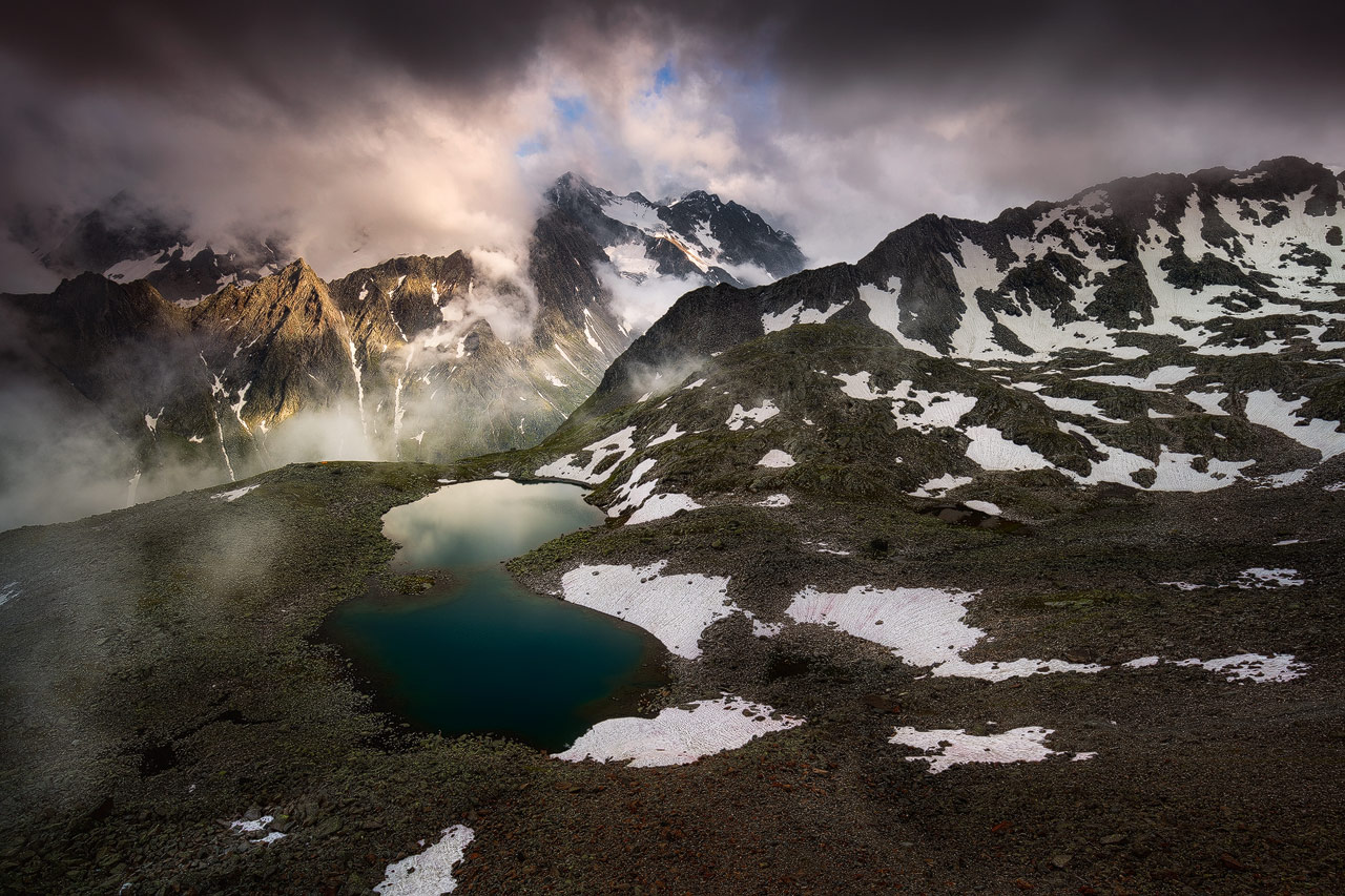 The Mountains of the Stubai Valley and the Rinnensee on a stormy evening.